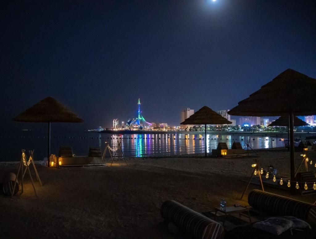 Marina Hotel Kuwait City Exterior photo The Atlantis Paradise Island at night