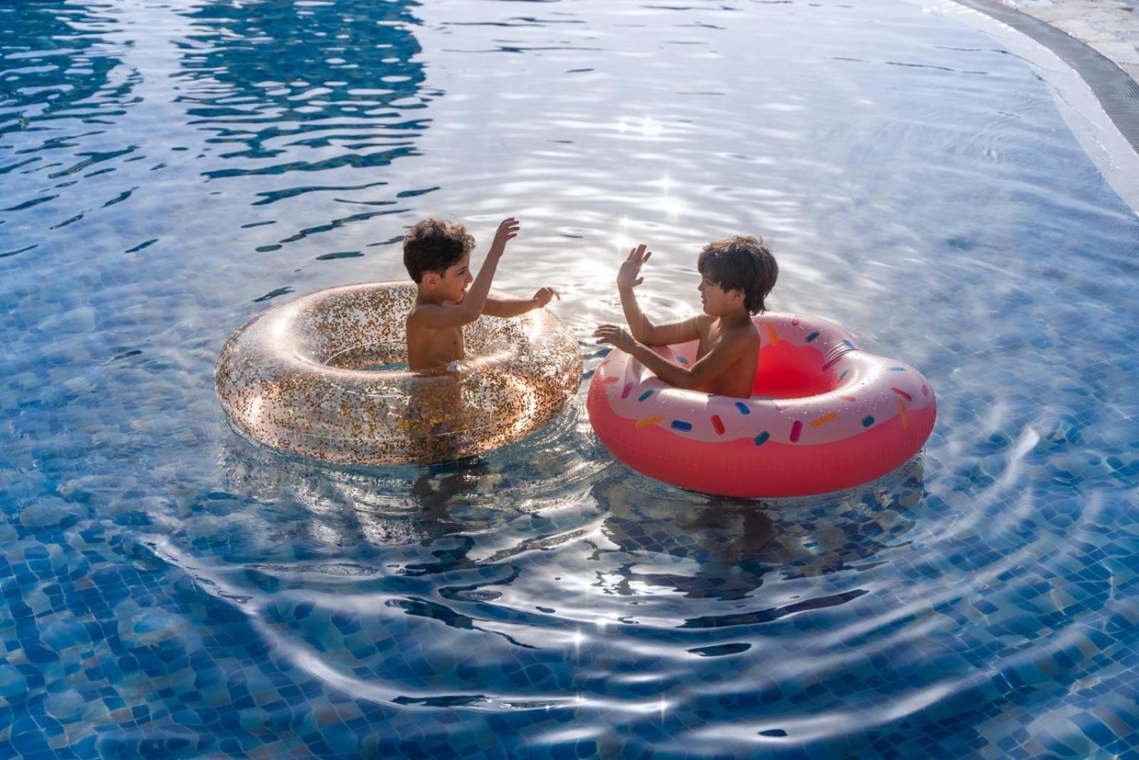 Marina Hotel Kuwait City Exterior photo Children playing with inner tubes